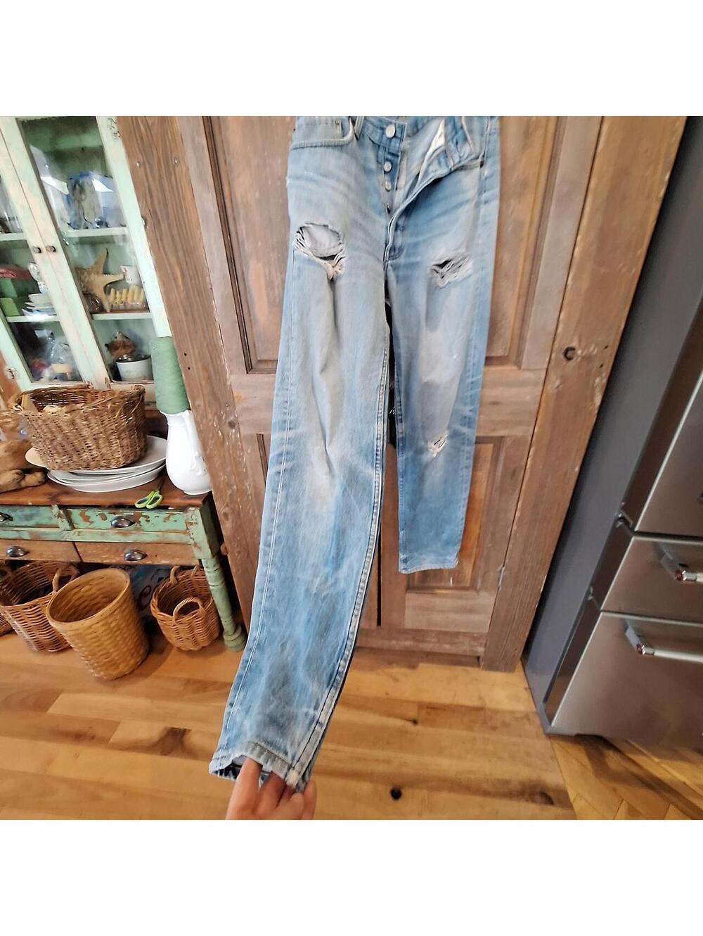 Vintage 1990's Levi's Men's Blue Jeans, button, paper tag.